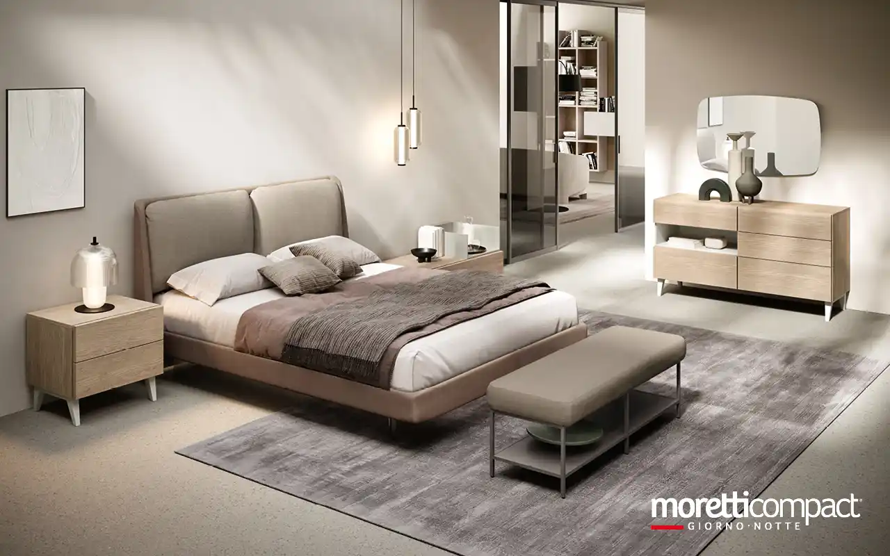 Camera con gruppo Modula e letto con cuscini imbottiti